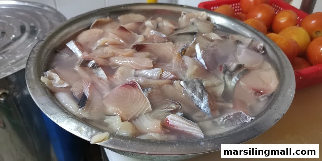 Fresh fish fillets soaking in water, ready for preparation at YumSea Seafood Soup.