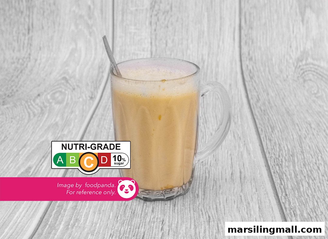 A frothy beverage in a glass mug, featuring a Nutri-Grade C label with 10% sugar.