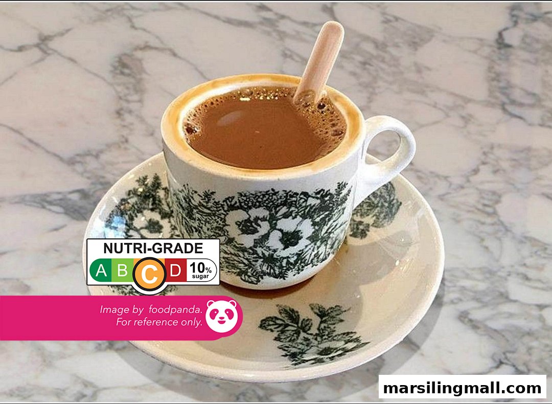 A traditional cup of coffee or tea with a Nutri-Grade label on a marble table.