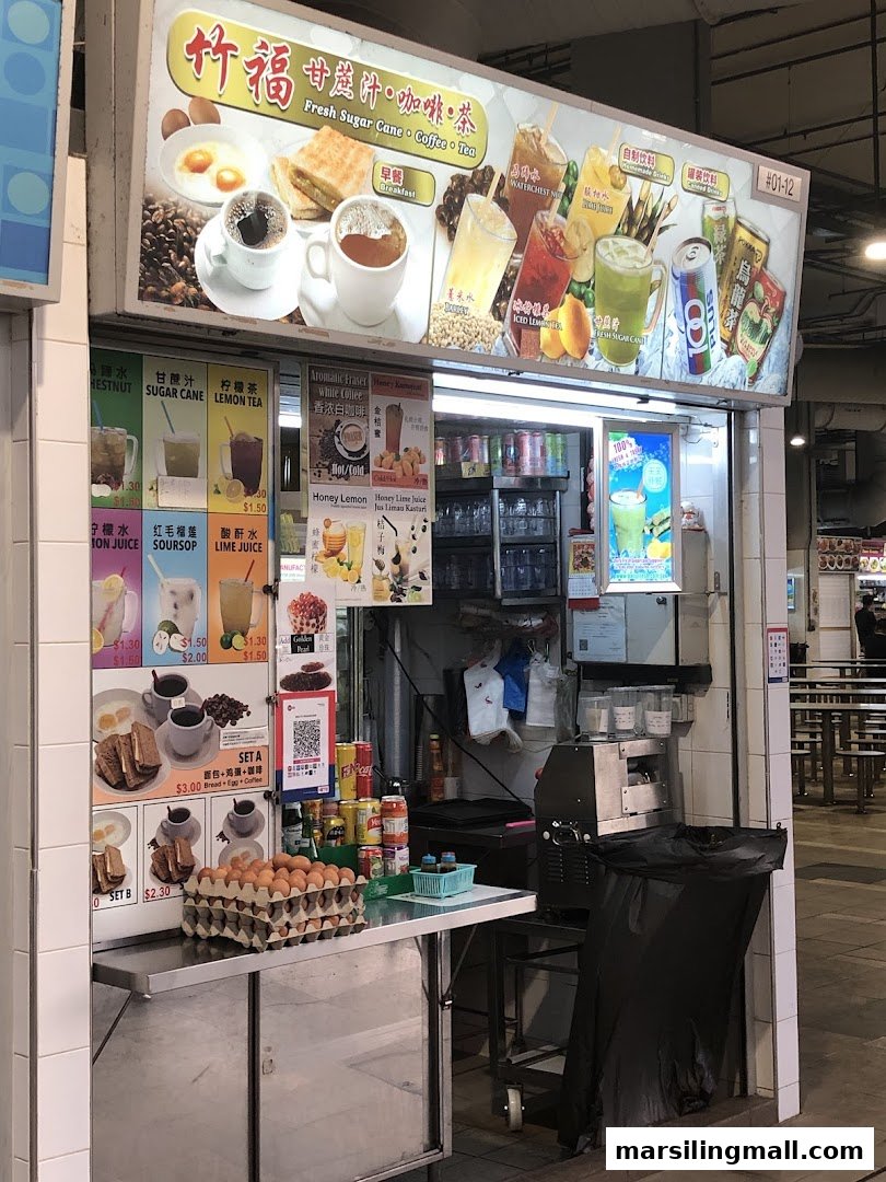 A vibrant stall displaying a wide range of fresh juices, traditional drinks, and breakfast sets.