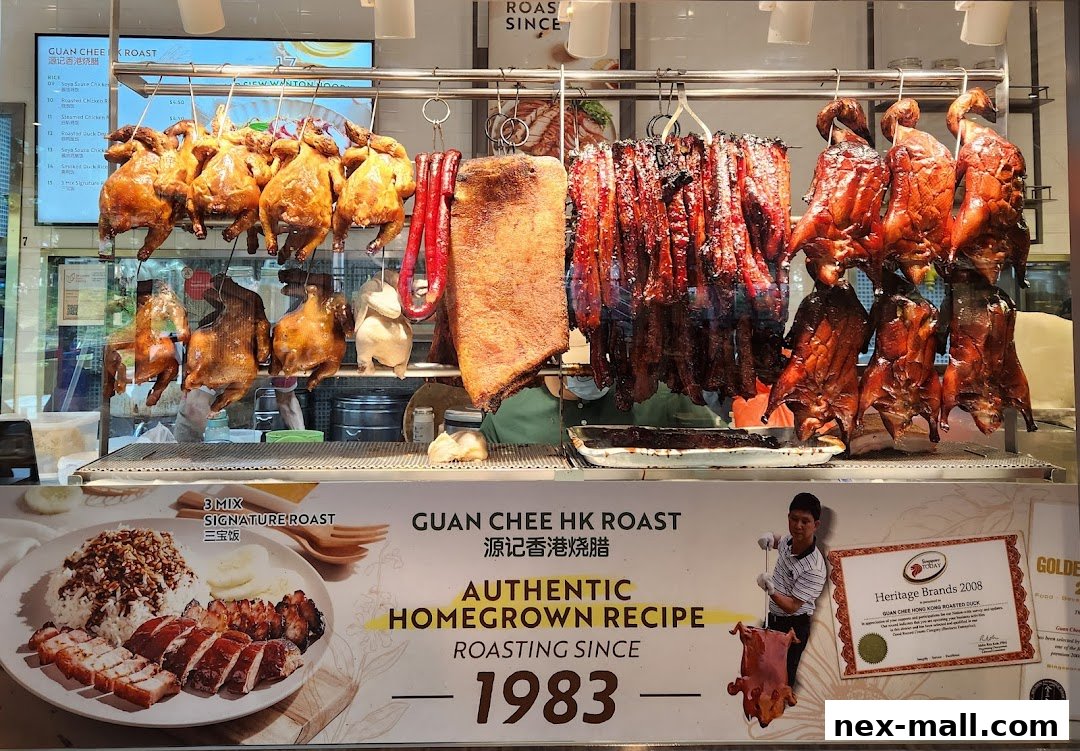 A display of various roasted meats, including ducks and pork, hanging in a food stall.