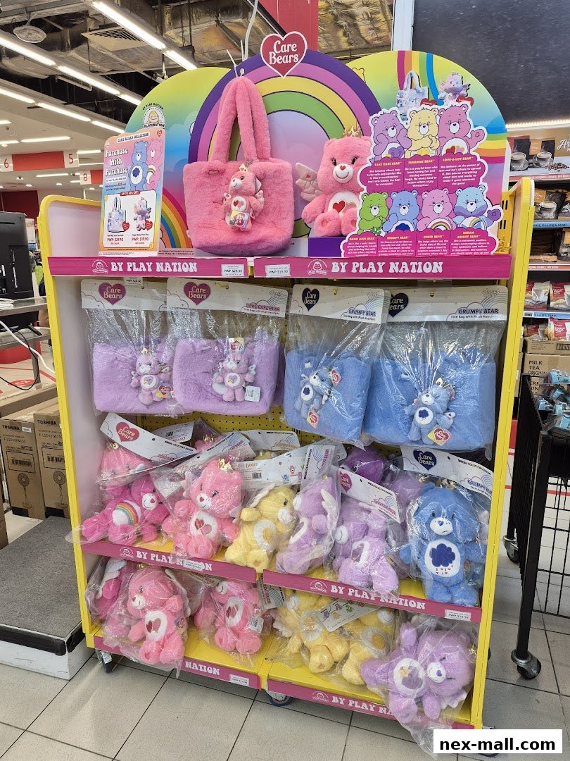 A display stand filled with Care Bears plush toys and bags in various colors.