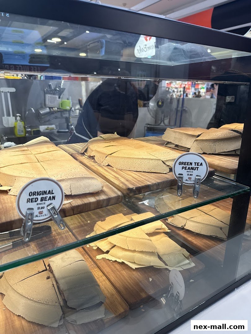 Display case filled with freshly made pancakes with various fillings.