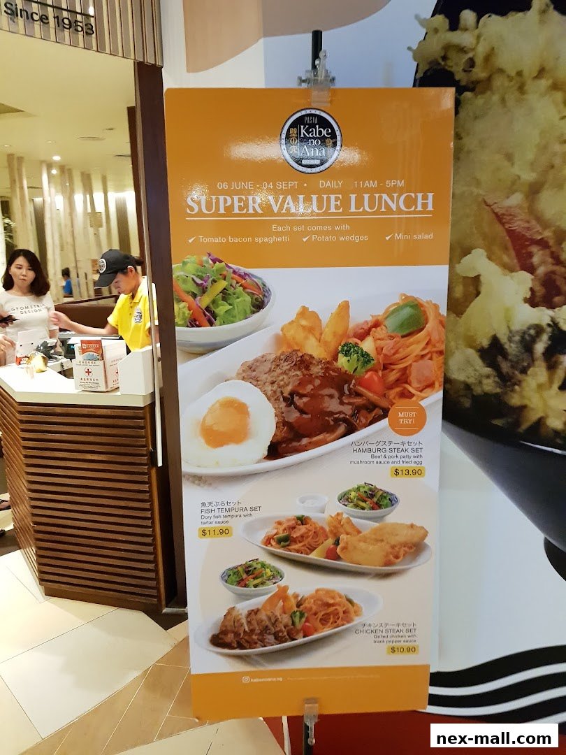 A promotional banner for JOY Japanese Food Street NEX featuring a Super Value Lunch menu.