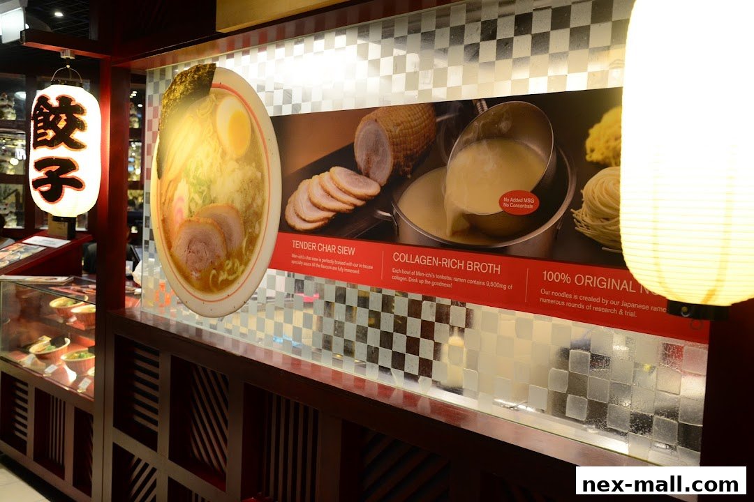 A display showcasing ramen ingredients and descriptions at JOY Japanese Food Street NEX.