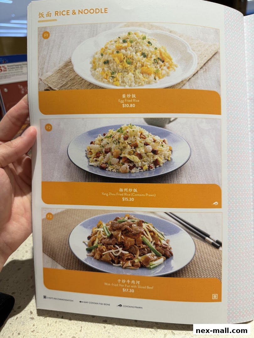A menu page from Canton Paradise featuring rice and noodle dishes with prices.