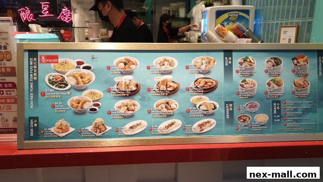 A menu board for Koo Kee Yong Tow Foo Mee, showcasing various noodle and soup dishes with prices.