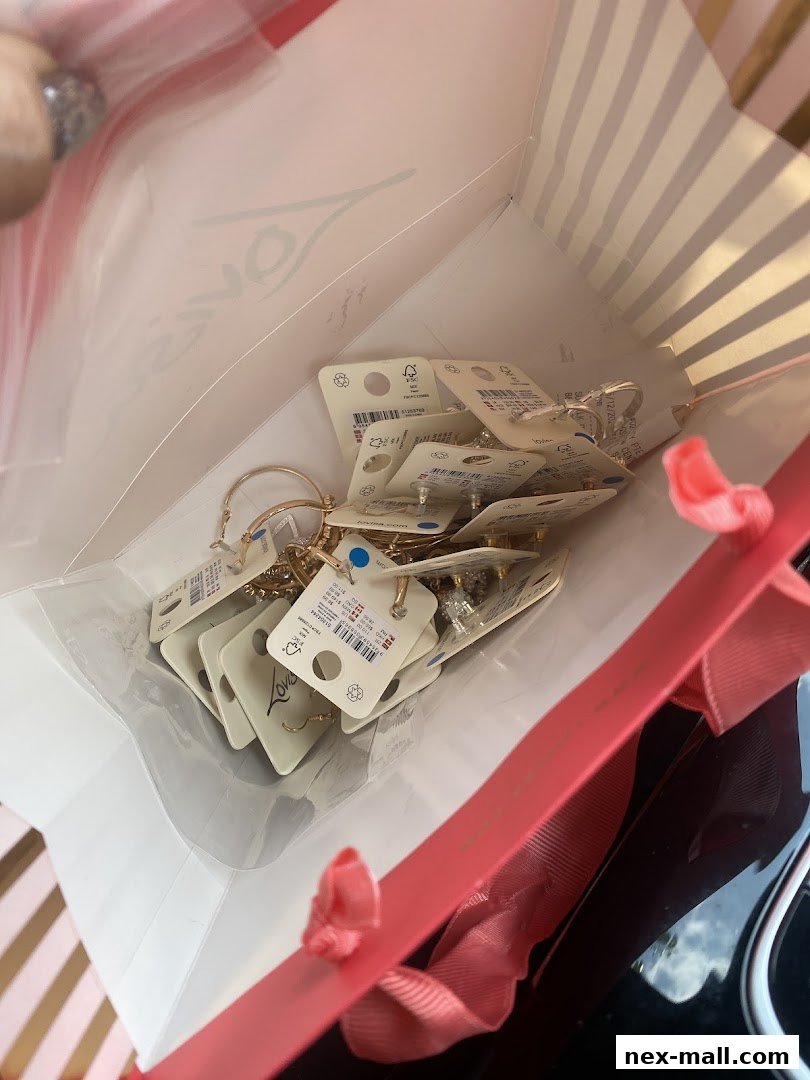 A shopping bag filled with various Lovisa earrings, showcasing new arrivals.