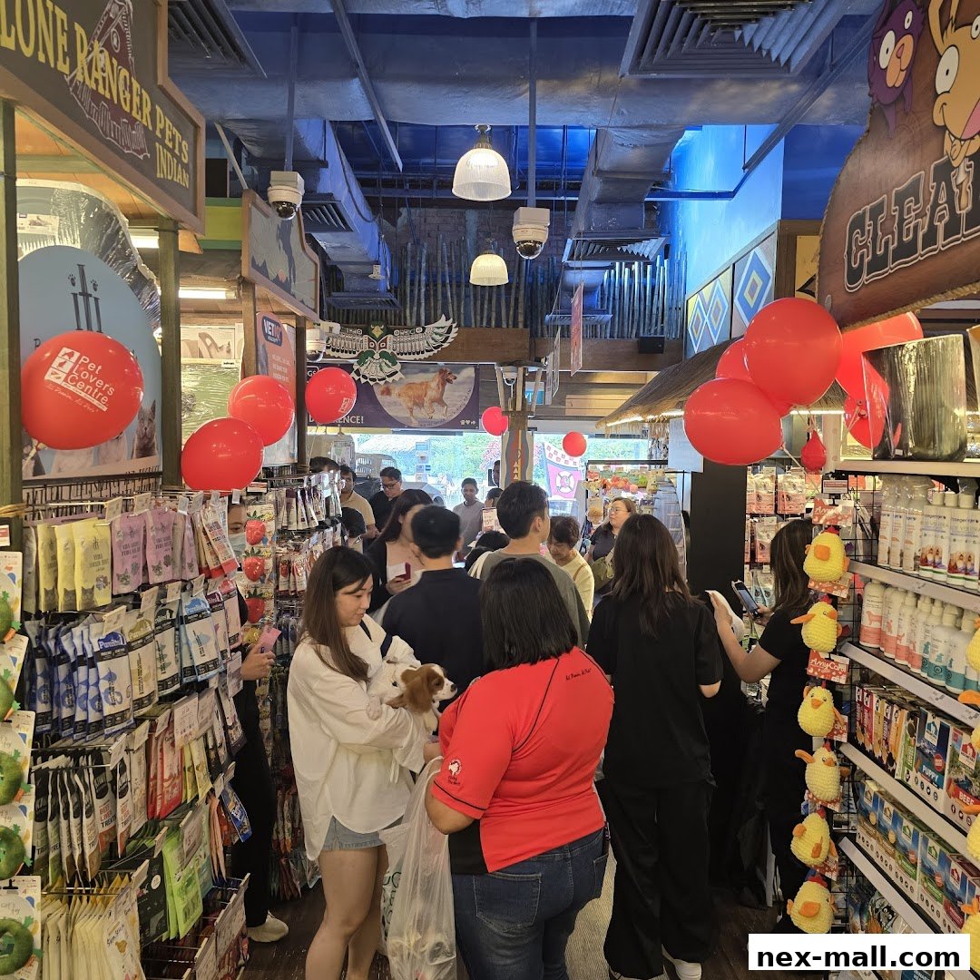 A busy pet store interior with customers browsing shelves stocked with pet supplies.