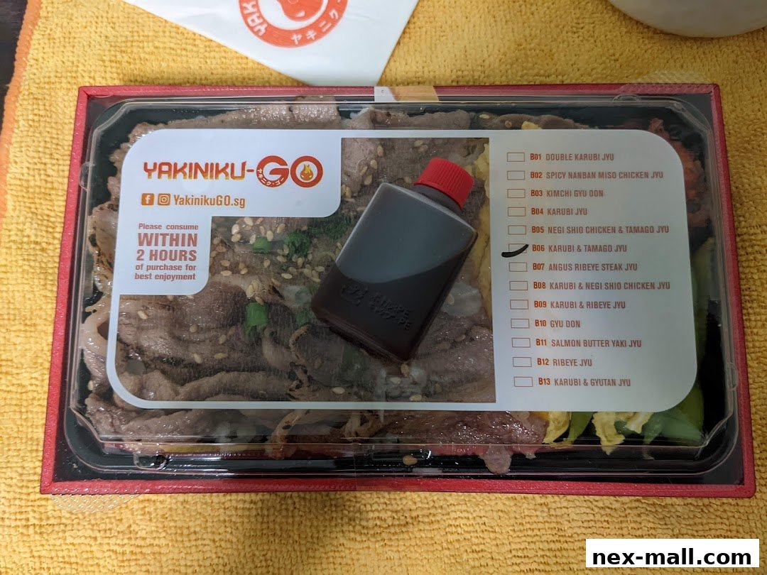 A takeout container of Yakiniku-GO with a selection of Japanese beef dishes.