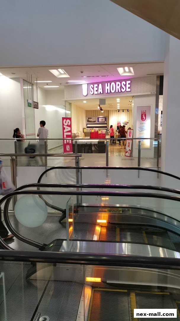 The Sea Horse shop front in NEX Mall, featuring a prominent sign and a sale banner.