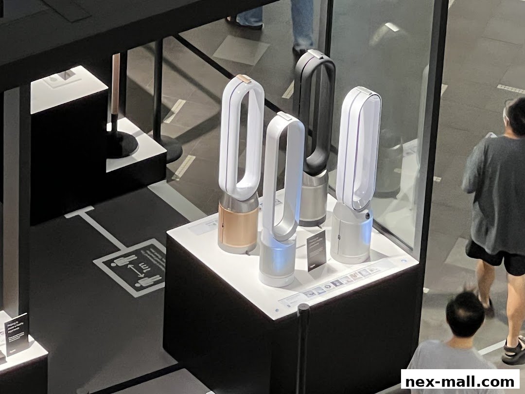 Dyson air purifiers displayed in a modern retail store setting with social distancing markers.