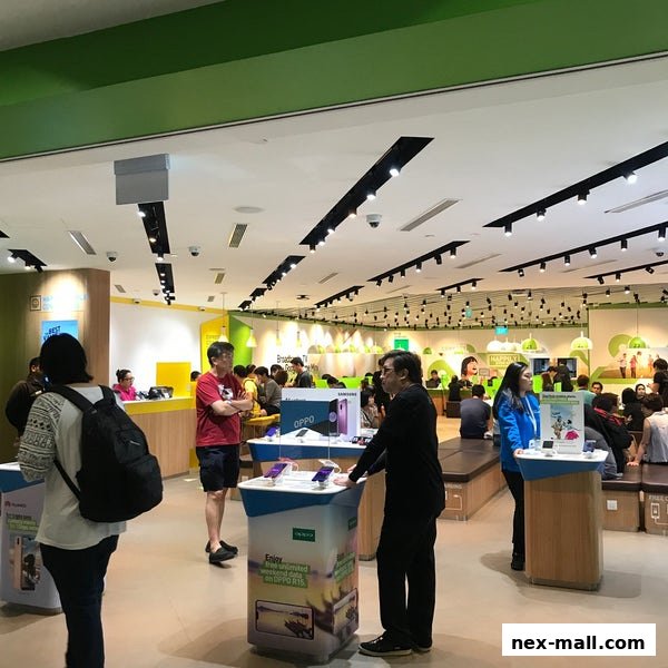 People browsing mobile phones and services inside a brightly lit StarHub store.