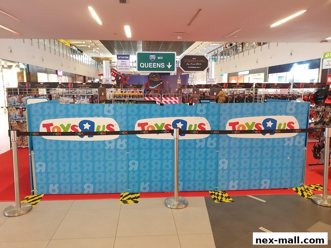 A Toys R Us pop-up store with Spider-Man branding and NEX signage.