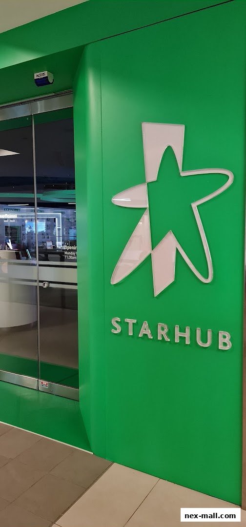 The entrance to a StarHub shop with its prominent green branding and star logo.