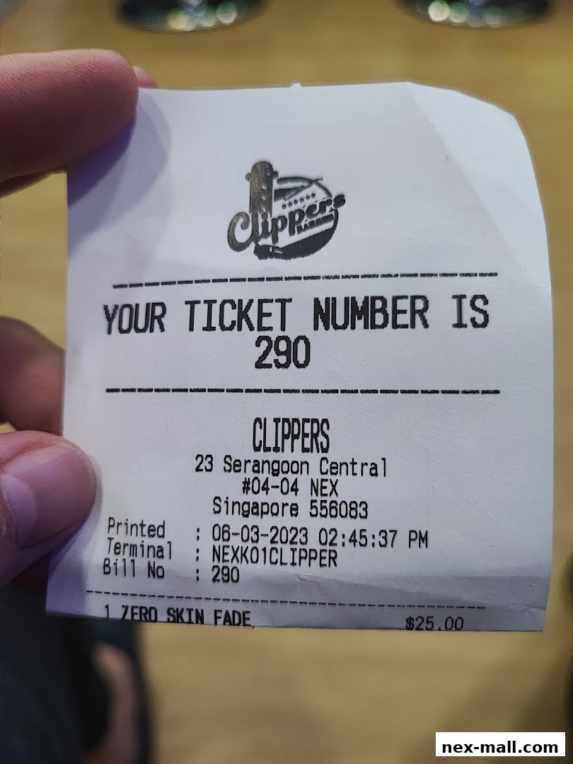 A receipt from Clippers Barber showing a ticket number and a zero skin fade service.