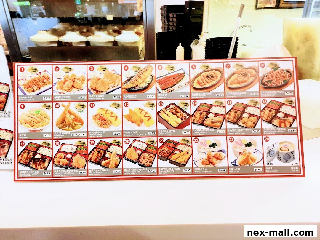 A menu board displaying various Japanese bento boxes and meal sets with prices.