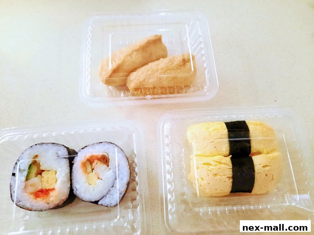 Three plastic containers filled with various sushi items, including rolls, inari, and tamago.