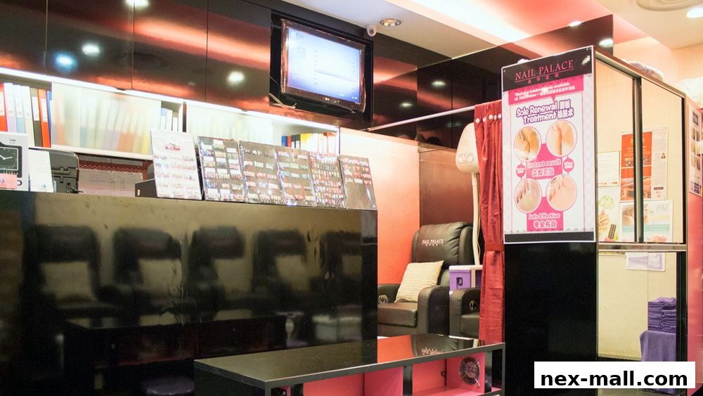 Interior of Nail Palace with reception desk, seating, and promotional posters.