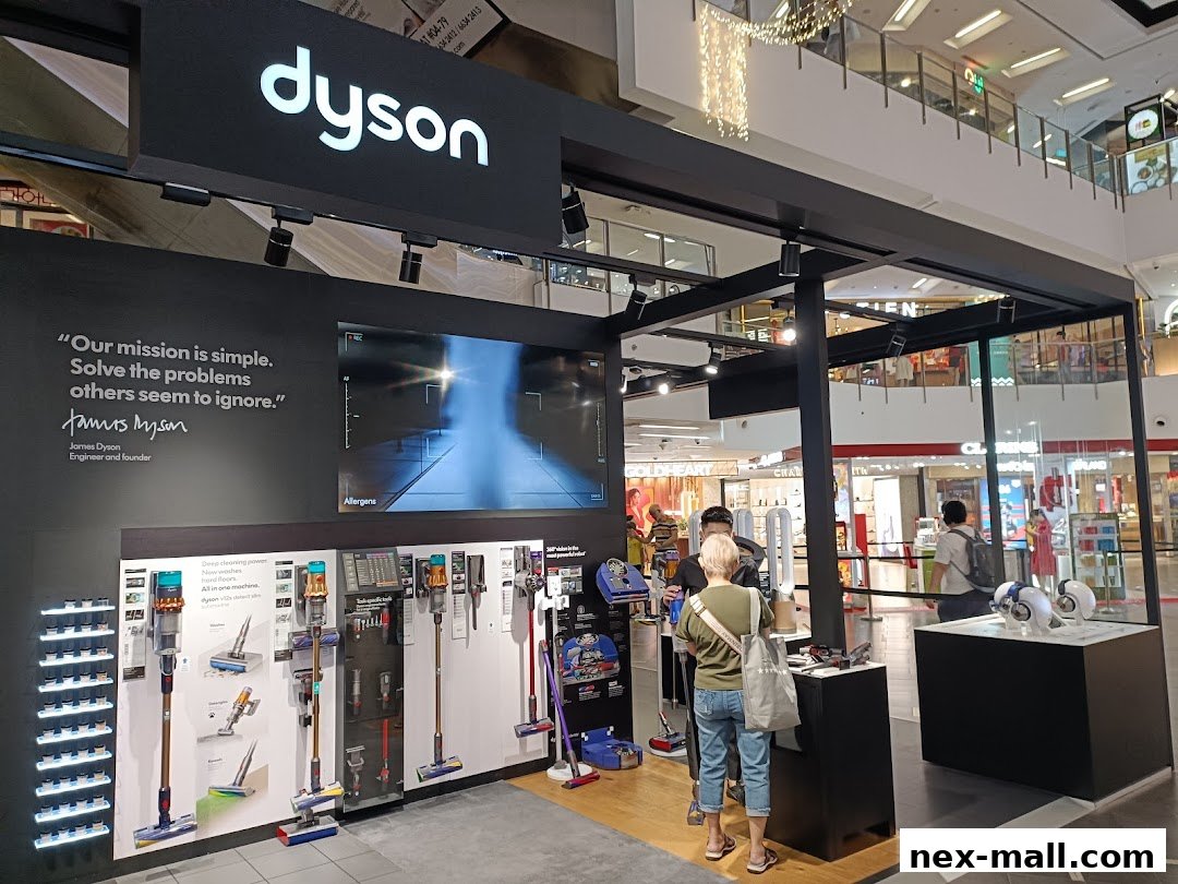 A Dyson store display featuring vacuum cleaners and a quote from James Dyson.