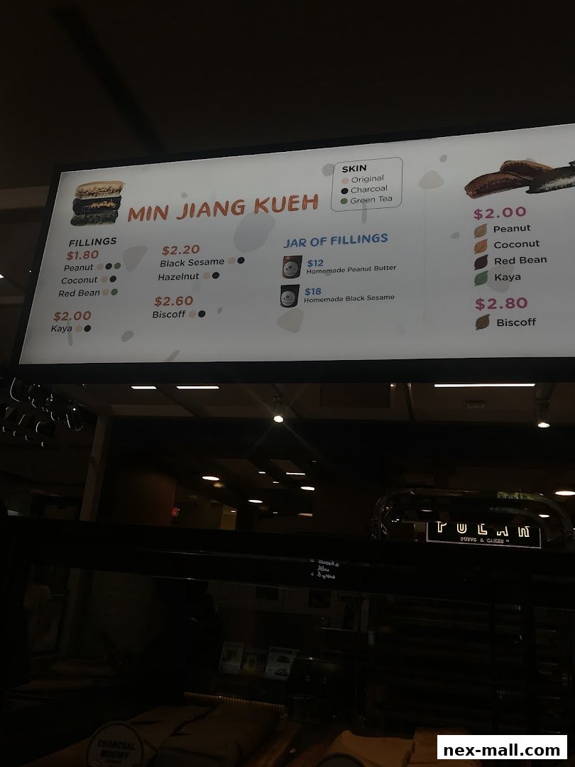 A menu board displaying various Min Jiang Kueh fillings and skin options with prices.