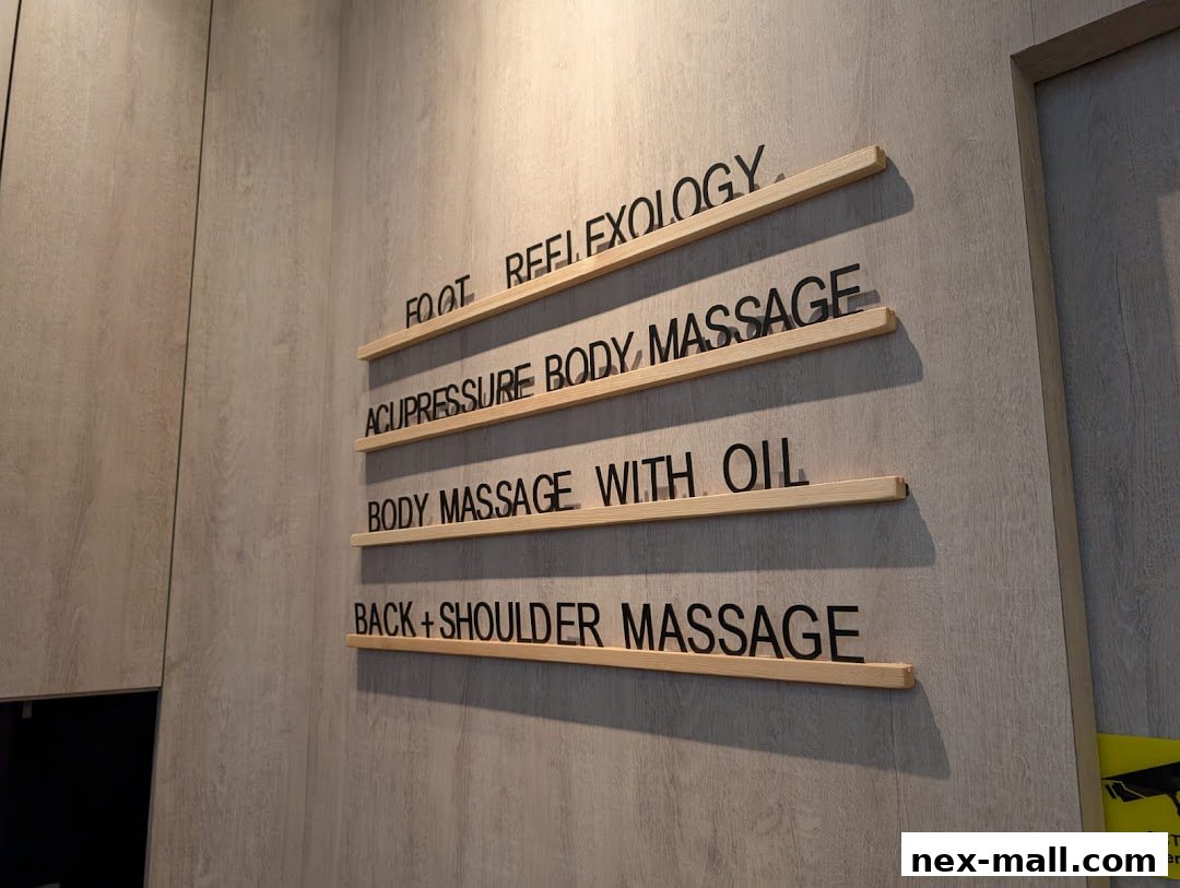 A wall with a list of massage services offered by FootNote Reflexology.