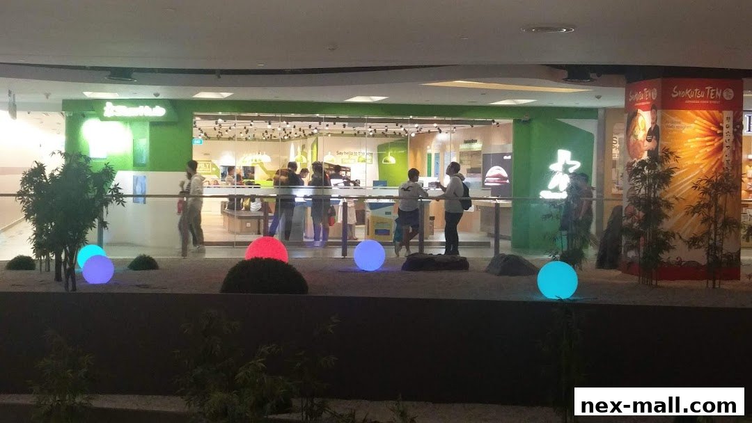 The StarHub Nex shop front with people inside and decorative glowing orbs outside.