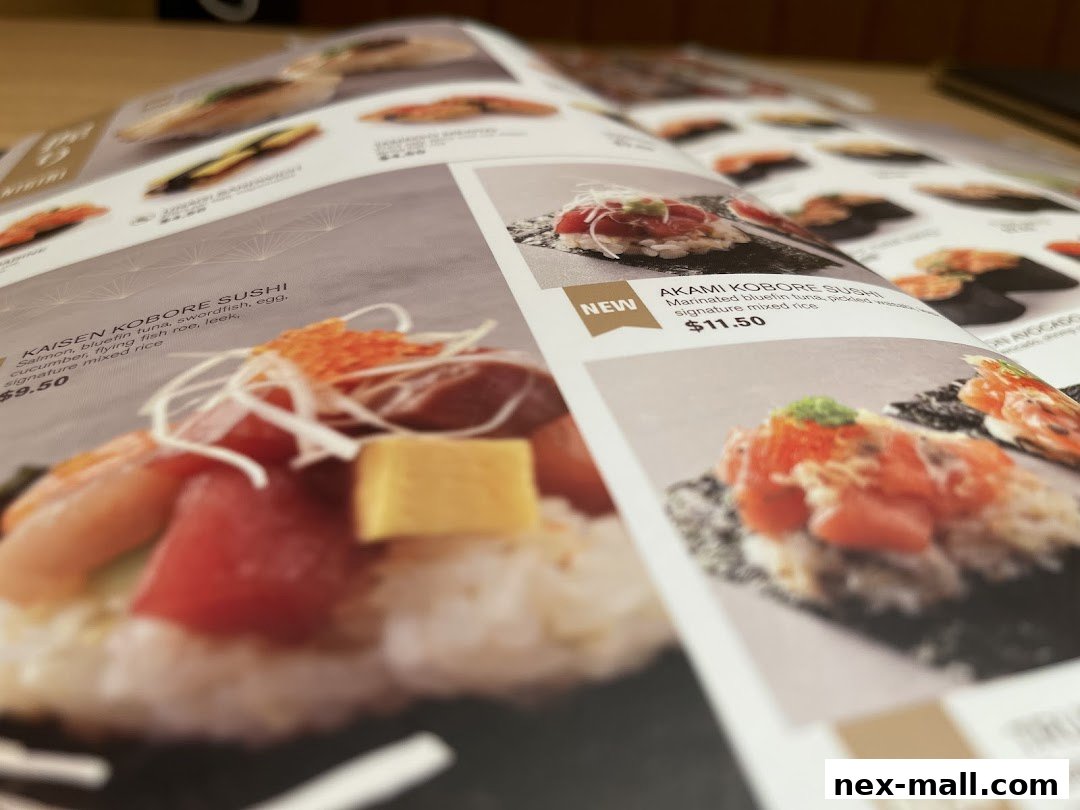 A close-up view of a sushi menu featuring various colorful sushi dishes.