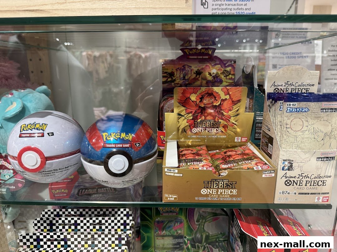 A display shelf filled with various trading card games, including Pokemon and One Piece.