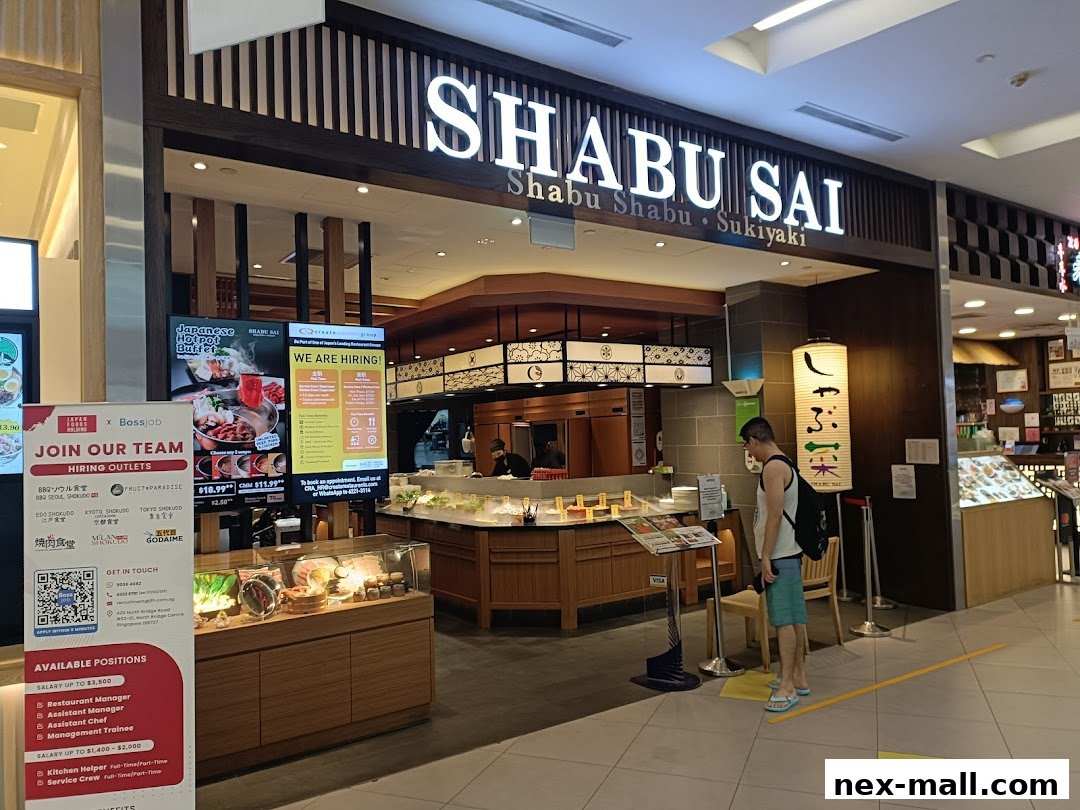The entrance of Shabu Sai, a Japanese hotpot and sukiyaki restaurant, with a hiring advertisement.