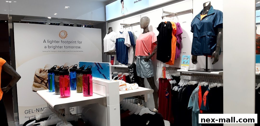 ASICS store interior showcasing athletic apparel, mannequins, and water bottles.