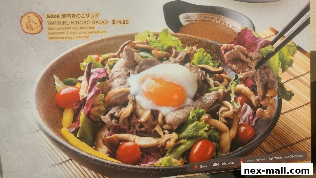 A close-up of a Yakiniku Kinoko Salad with beef, poached egg, mushrooms, and vegetables.