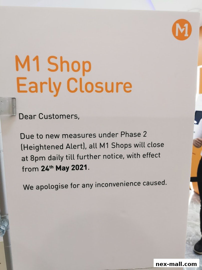 A sign announcing early closure for M1 Shops due to new measures.