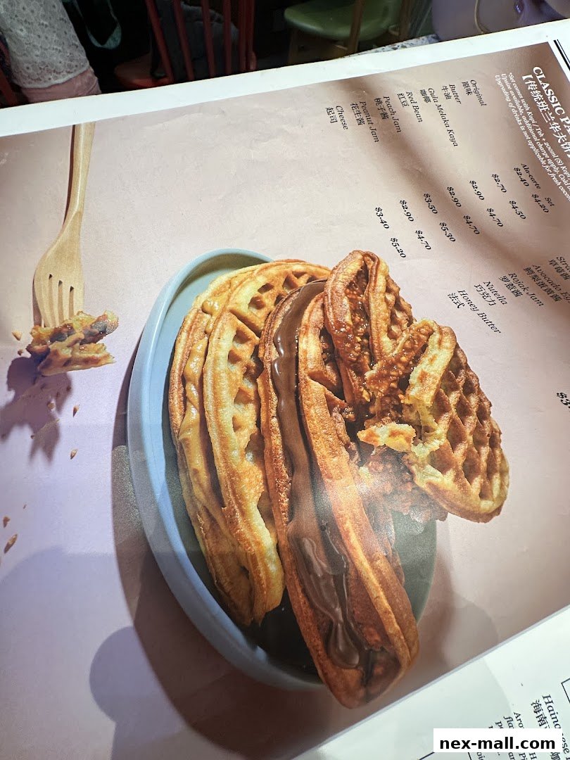 A close-up of a menu featuring classic waffles with various fillings and prices.