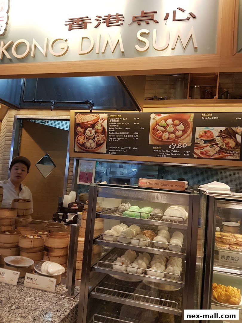 A food stall displaying various dim sum items and a menu board with prices.