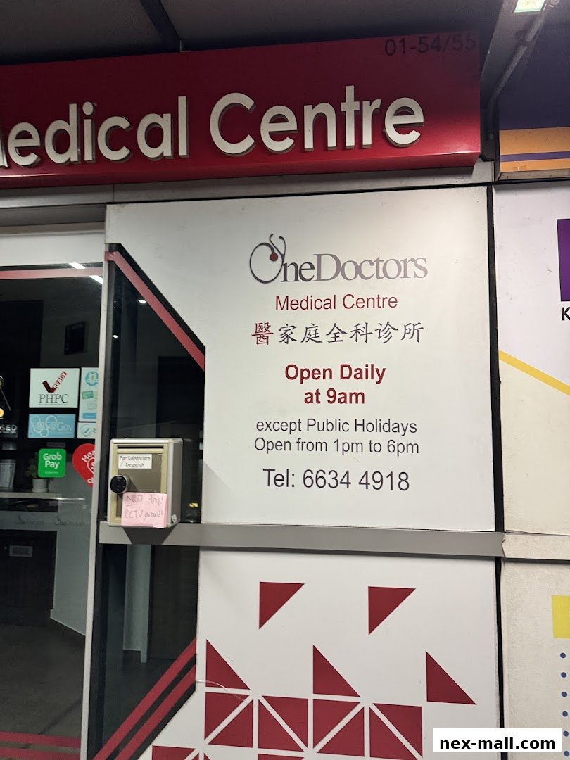 The entrance of OneDoctors Medical Centre, displaying operating hours and contact information.