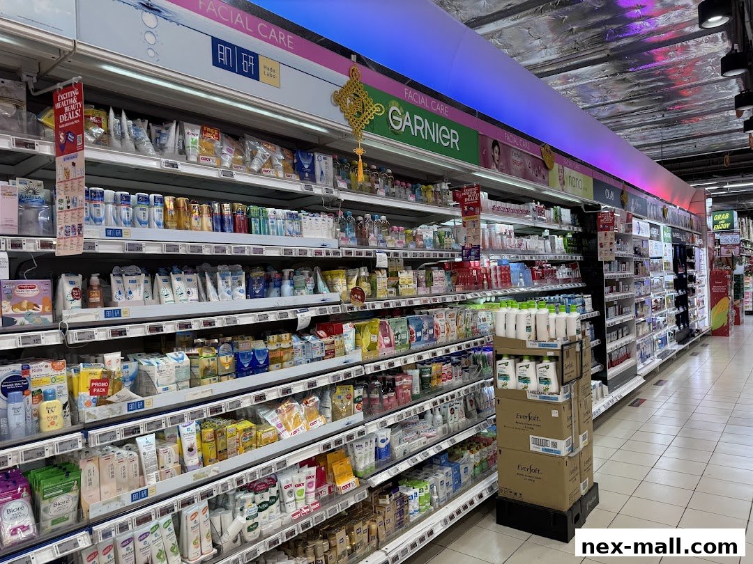 A wide aisle in a supermarket stocked with various facial care and beauty products.