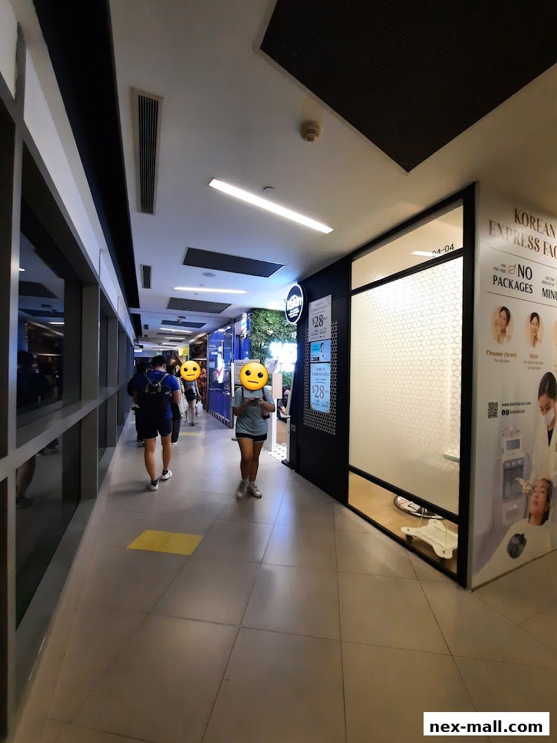 A hallway leading to Kskin Korean Express Facial shop with promotional posters.