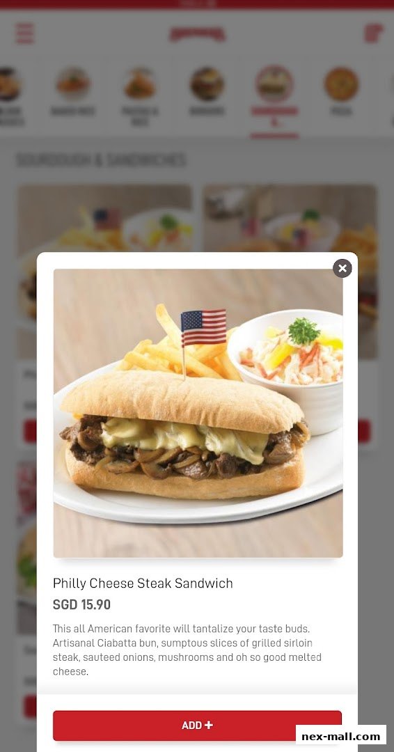 A close-up of a Philly Cheese Steak Sandwich with fries and coleslaw.