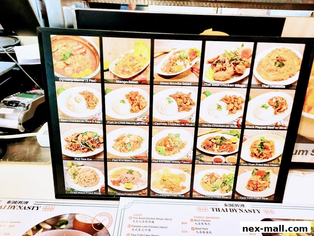 A framed menu board displaying various Thai dishes with appetizing photos and names.