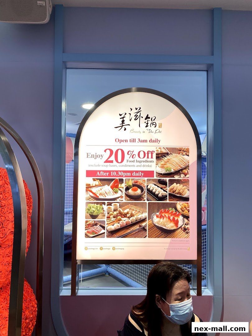 A sign advertises a 20% discount on food ingredients at Beauty in The Pot.