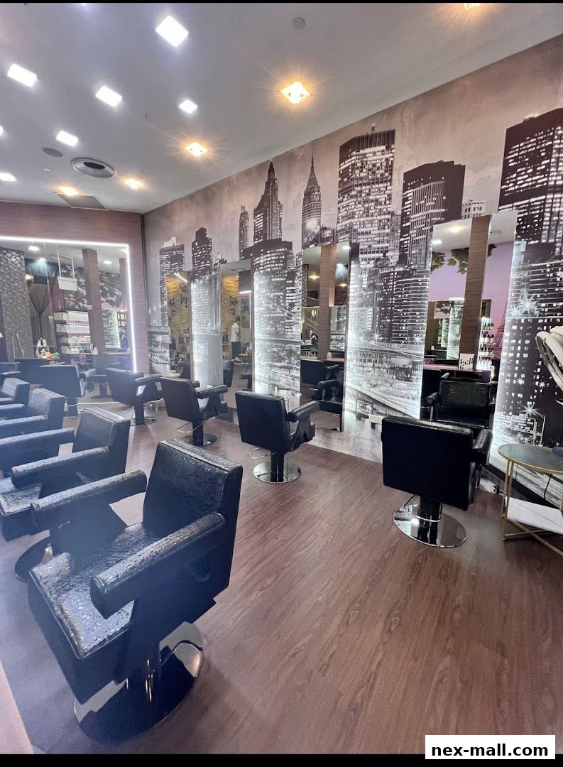 Interior of a modern hair salon with multiple styling chairs and a New York skyline mural.