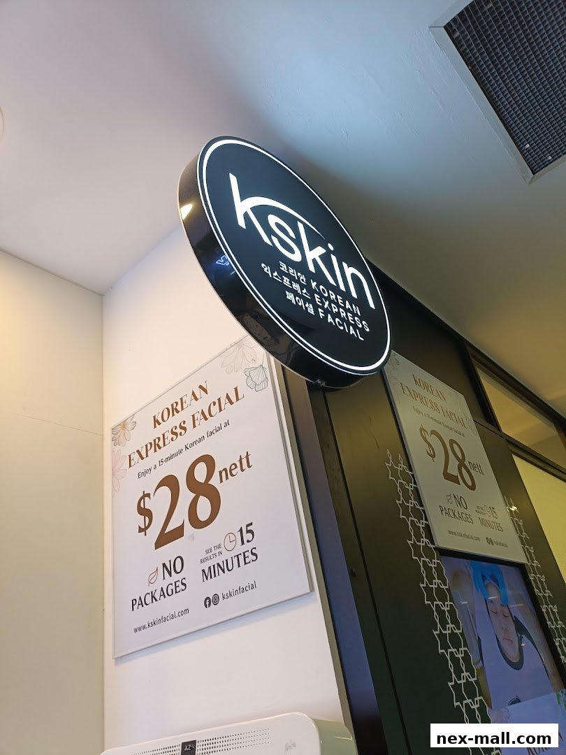 A sign for Kskin Korean Express Facial offering a 15-minute facial for $28.