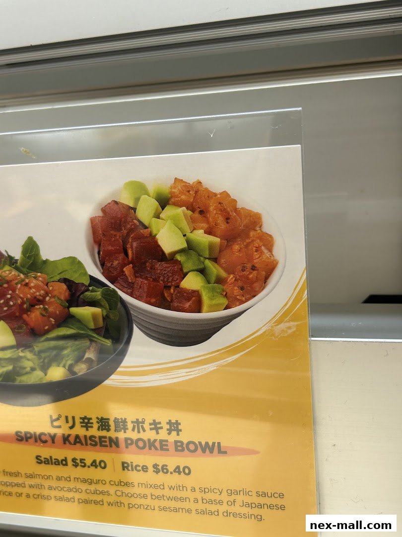 A close-up of a menu item featuring a Spicy Kaisen Poke Bowl with salmon, maguro, and avocado.