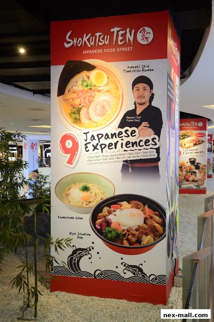A pillar display for Shokutsu Ten Japanese Food Street featuring ramen, udon, and donburi dishes.