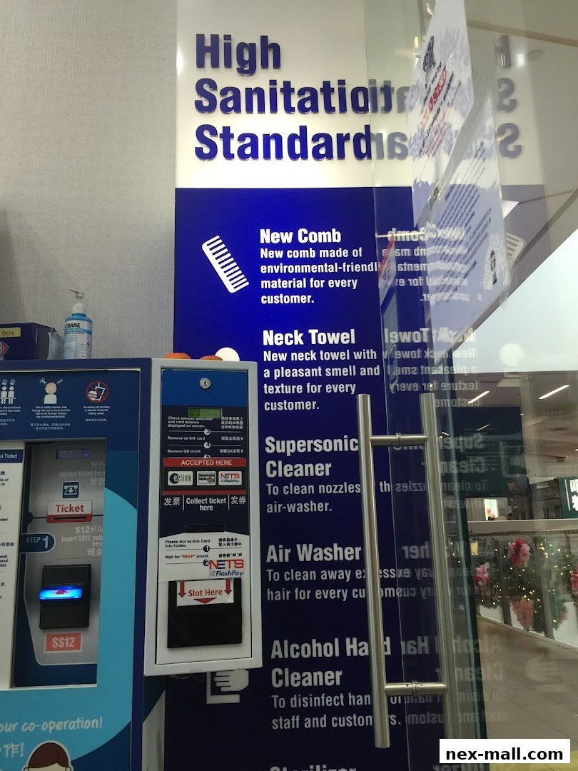 QB House NEX shop front with sanitation standards and services displayed.