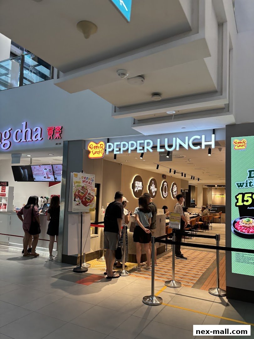 Customers queue at the entrance of Pepper Lunch Express, a popular fast-casual restaurant.