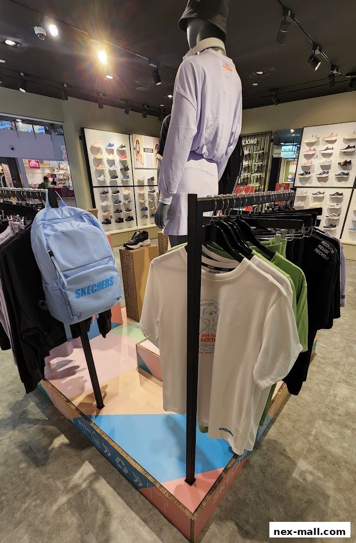 Interior of a Skechers store showcasing apparel and footwear displays.
