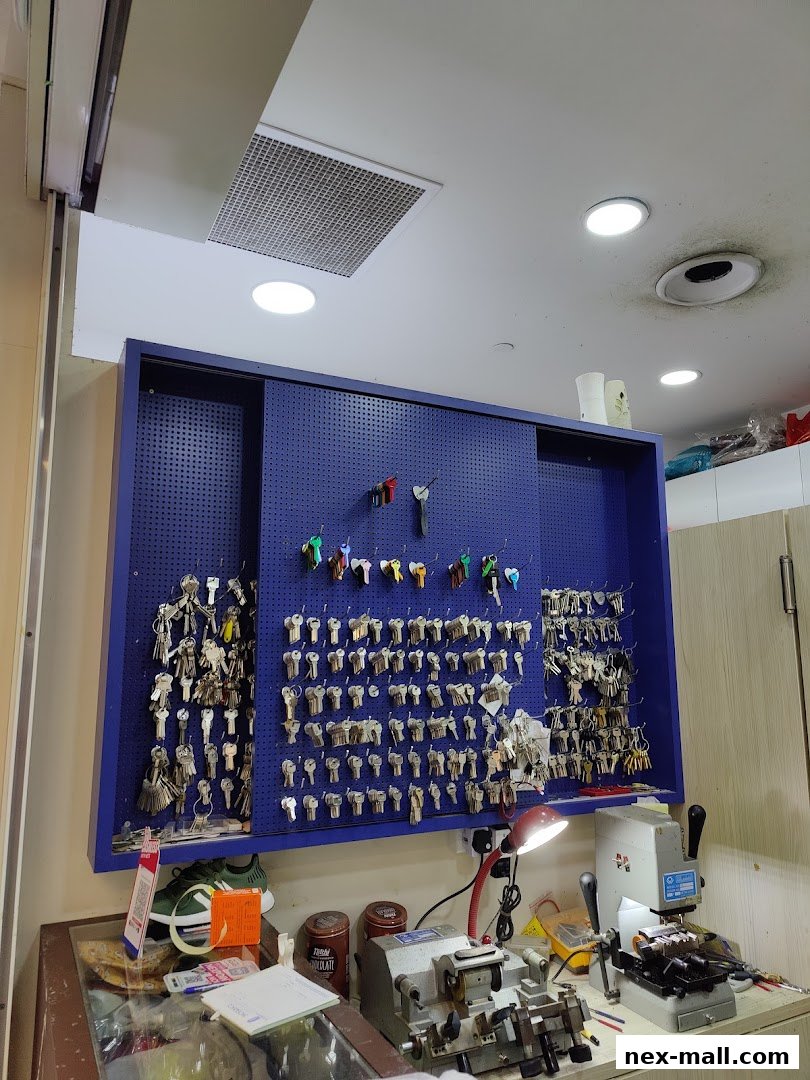 A shop interior displaying a large collection of keys and key cutting machines.