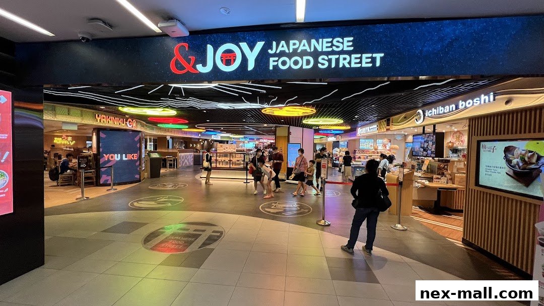 Entrance to a Japanese food street with various eateries and people browsing.